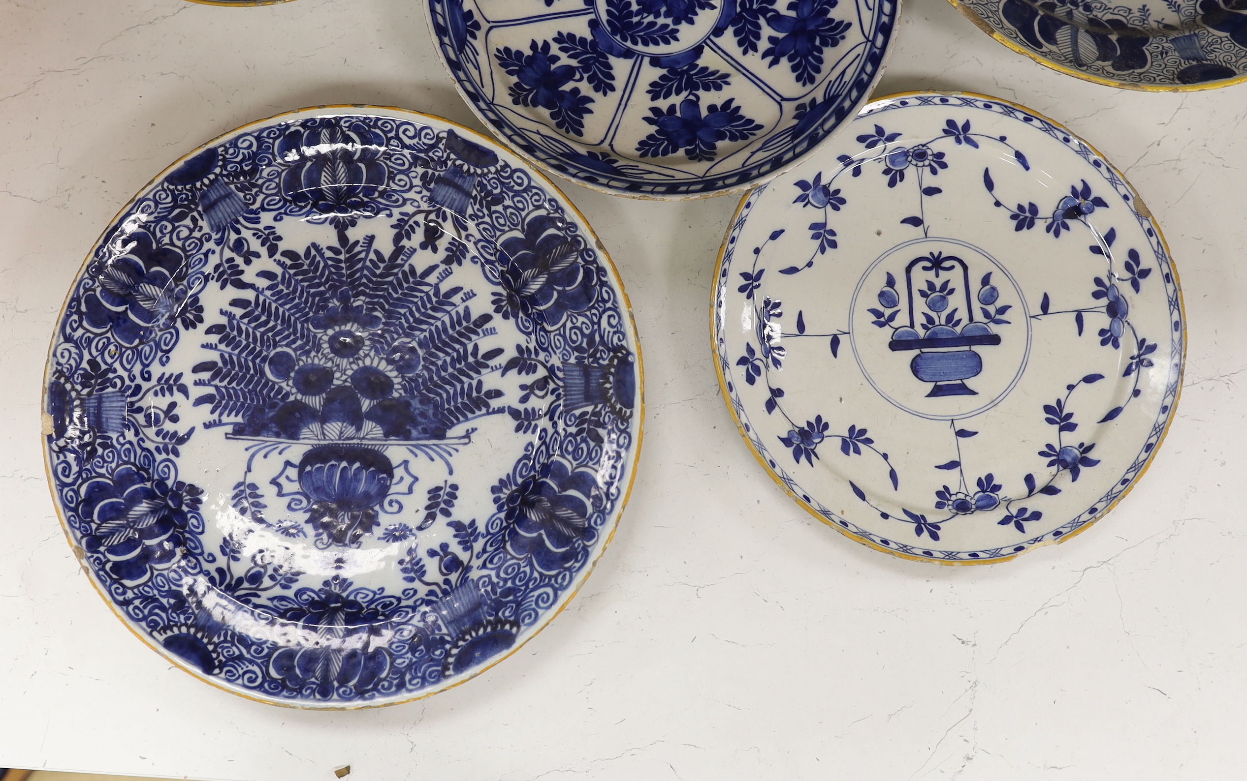 Five 18th century Delft blue and white plates, largest 31cm